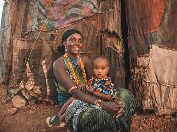 Portrait of Wato Elema and Talaso Shama. Wato is grateful for the Water Trucking Project that PACIDA supported by CARITUS is doing, now she can get water easily from the tanks and not so far away like before.